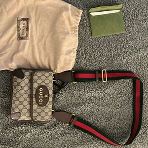 Gucci neo vintage small messenger in GG monogram print with webbed strap.